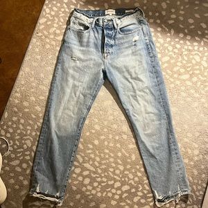 Frame Light-wash ripped denim jeans.